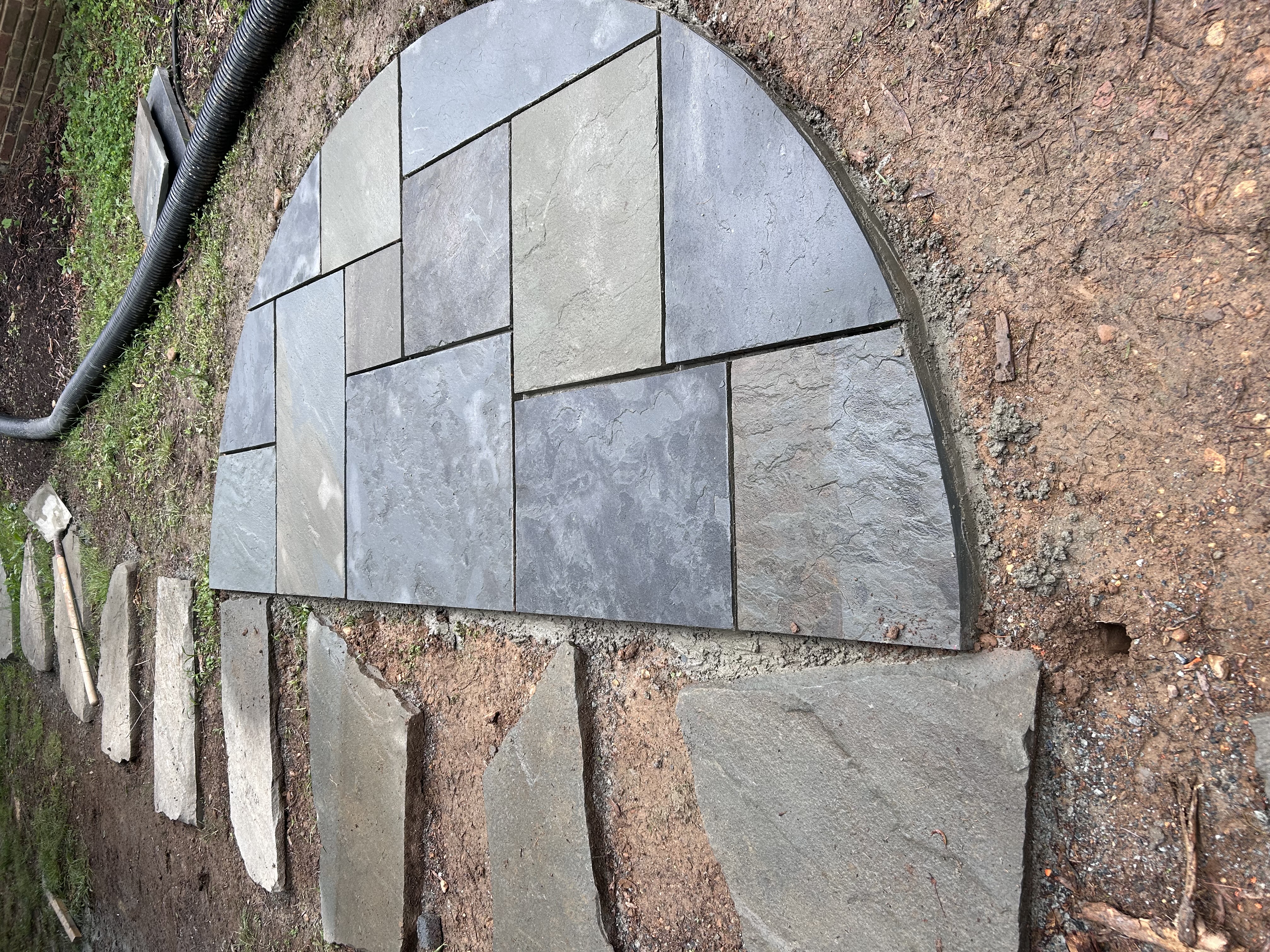 Circular bluestone landing with stepping stones